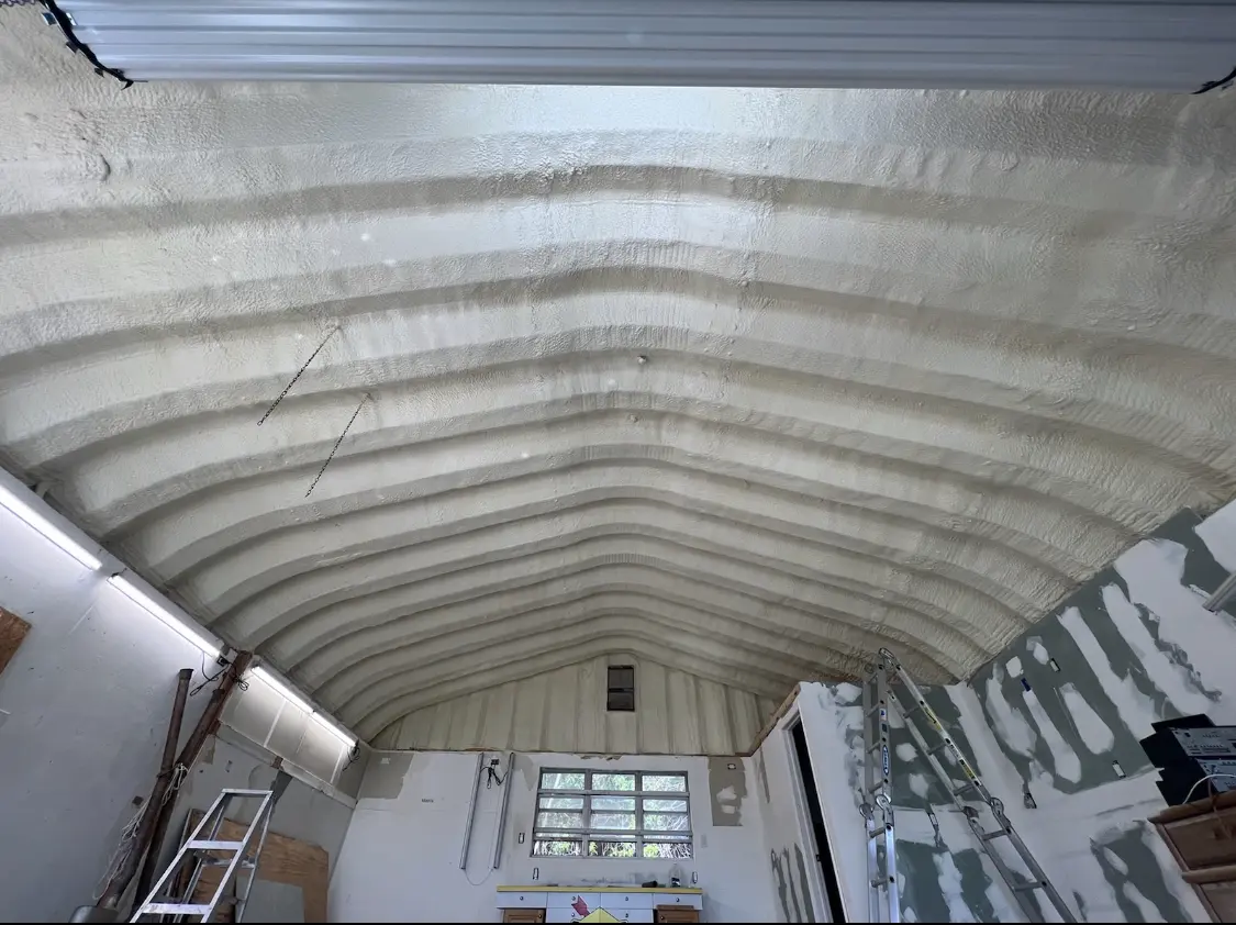 Spray polyurethane foam applied to the underside of a metal roof deck in Leisure World